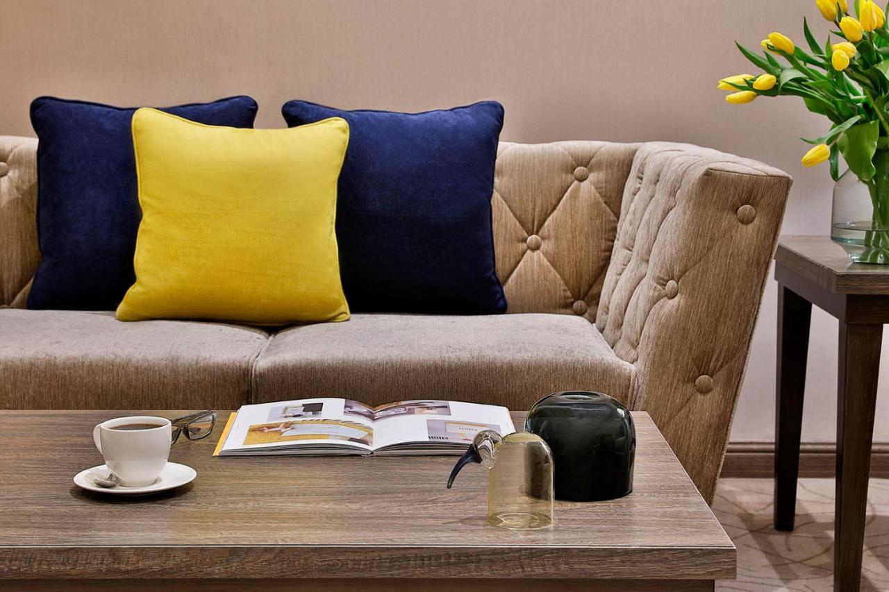 Voco Al Khobar By Ihg Hotel Exterior photo A sofa with cushions