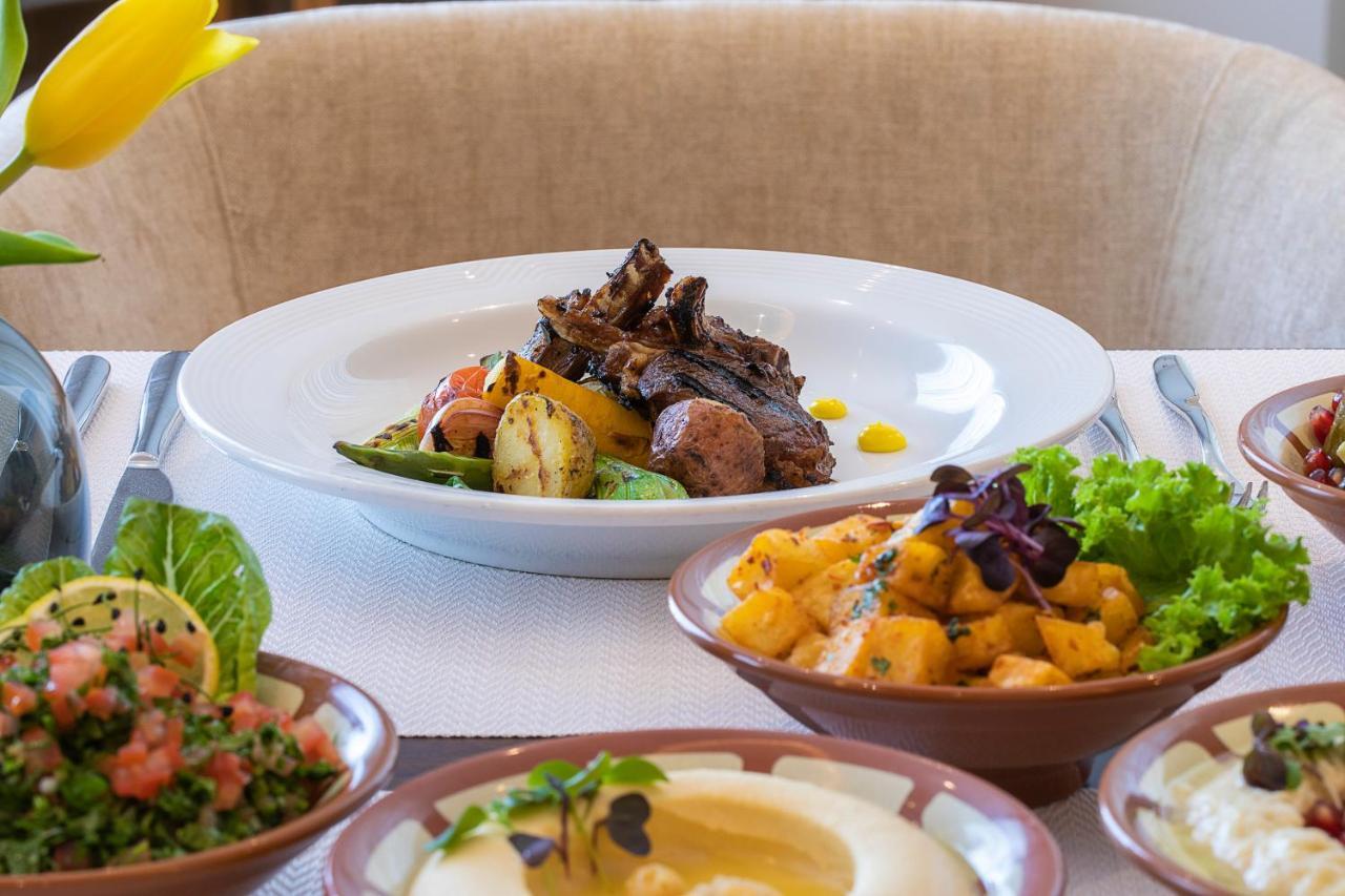 Voco Al Khobar By Ihg Hotel Exterior photo A selection of dishes at the restaurant
